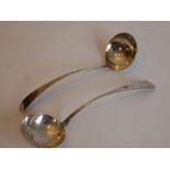 A pair of early 19th century hallmarked silver Old English Pattern ladles; maker's mark FW,