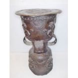 An interesting patinated bronze circular-topped Eastern stool or stand; probably late 19th or