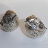 A rare pair of Edwardian hallmarked silver pincushions modelled as wrens; maker's mark of Sampson