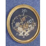 A 19th Century gilt framed and glazed (probably late Regency period) floral embroidery onto black