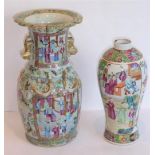 A 19th century Chinese porcelain Canton vase typically hand-decorated with figures in the famille