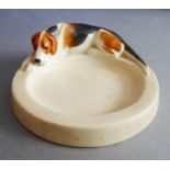 An early 20th century Royal Worcester porcelain pin tray by Doris Lindner, 'Hound'; in good