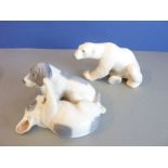 A Royal Copenhagen model of two puppies playing, together with one other similar-sized Danish