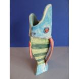 A handmade ceramic jug/vase modelled studio style in the form of a vertical open-mouthed fish,