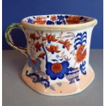 A mid-19th century Mason's Patent Ironstone Pottery chamber pot/mug, the handle modelled as a