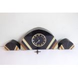 A French Art Deco marble and black-slate arched, shaped mantel clock, the chapter ring with Arabic
