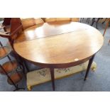 A pair of late 18th/early 19th century George III period mahogany demilune tables, each raised on