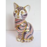 A Royal Crown Derby paperweight modelled as a seated cat; hand gilded and decorated in the Imari