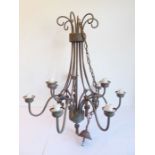 A heavy wrought-iron nine-branch candelabra together with one other smaller painted example modelled