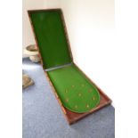 A 19th century folding mahogany bagatelle table