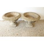 A pair of verdigrised stoneware garden planters in Campana style; square plinth bases, egg-and-