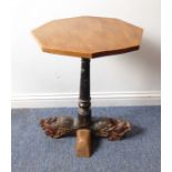 An unusual occasional table; the later octagonal elm top above a late 19th century carved and
