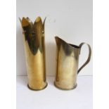 Trench Art; a WWI brass shell case as a vase and one further as a jug with handle (the vase 27.5cm