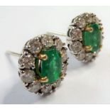 A pair of emerald and diamond cluster ear studs (The cost of UK postage via Royal Mail Special