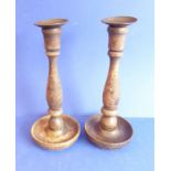A pair of 19th century stained-wood candlesticks with brass nozzle (23.5cm high)