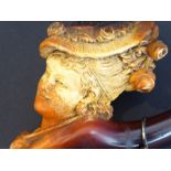 A Victorian cased meerschaum pipe with amber stem in the form of a Gainsborough lady