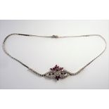 An 18-carat white-gold, ruby and diamond necklace (The cost of UK postage via Royal Mail Special