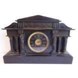 A large late 19th century black slate mantel clock in Classical style and with gilded French