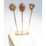 Three Victorian gold stickpins (ruby, diamond and pearl) (The cost of UK postage via Royal Mail