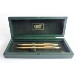 A cased 'Cross' pen and pencil set (The cost of UK postage via Royal Mail Special Delivery for