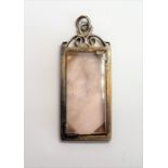 A silver-mounted pendant centrally set with a raised vertical hardstone (possibly smoky quartz) (4cm