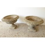 A pair of verdigrised stoneware garden planters in Campana style; square plinth bases, egg-and-
