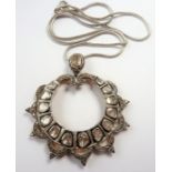 An unusual pendant set with large diamonds (The cost of UK postage via Royal Mail Special Delivery