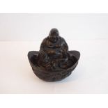 A small bronze seated Buddha (The cost of UK postage via Royal Mail Special Delivery for this lot