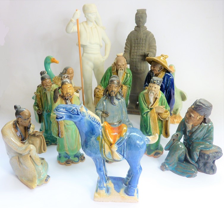 A assortment of mostly Chinese ceramics and pottery to include figures, some items in early Tang