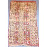A small hand-knotted, multi-coloured, Eastern-style rug