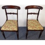 A pair of late Regency/William IV rosewood salon chairs having carved crest rails and turned