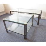 A modern designer glass-topped chrome coffee table en-suite with one further smaller square example,