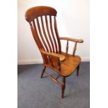 A 19th century lathe-back open armchair, shaped elm seat and turned tapering slightly splaying