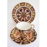 A Royal Crown Derby cup and saucer in Imari pattern no. 2451, dated 1917, together with a similar