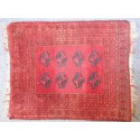 A hand-knotted Pakistan Bokhara rug with 'elephant's foot' pattern (112cm x 91cm)
