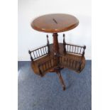 19th century circular figured walnut-topped revolving bookcase, the revolving gallery above a tripod