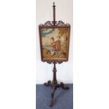 A fine early Victorian rosewood firescreen with a Scottish needlework tapestry depicting young