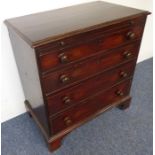 A late 18th century mahogany chest of small proportions; the moulded top above brushing slide and