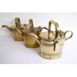 Three early 20th century brass watering cans
