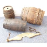 Three coopered barrels of varying sizes together with an antique yoke (4)