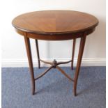 A Sheraton revival oval mahogany occasional table; the quarter veneered top above slender square