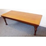 A late 19th century rectangular oak side table raised on turned tapering reeded front legs