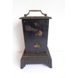 An usual heavy cast-iron clockwork driven spit-roaster (possibly French), the two tin sides
