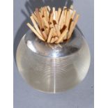 An early 20th century spherical glass match-strike/holder having a silver-mounted rim