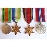 A WWII group of four: the Defence Medal, the 1939-45 War Medal, the Atlantic Star and the Burma