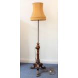 An adjustable walnut lamp standard and shade; 19th century carved fluted column above a tripod