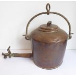 A darkly patinated 19th century copper range kettle; arched iron handle and protruding tap (52cm