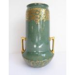 A Royal Worcester vase of cylindrical form with a pair of gilt handles in the Art Deco style; the