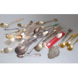 An interesting selection of silver and silver-plated spoons and dessert forks etc.