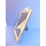 A large hallmarked silver easel picture frame